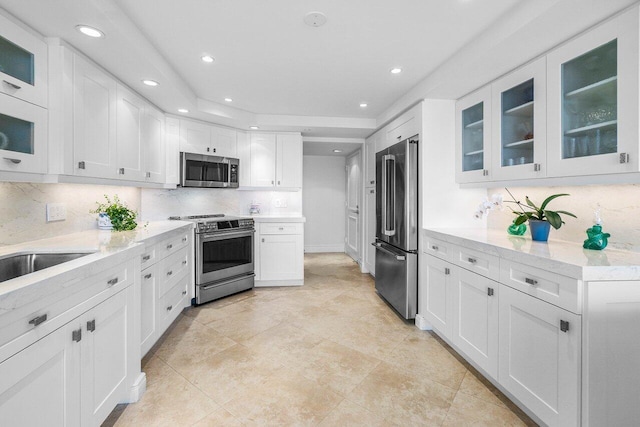 4001 N Ocean Blvd Unit 1108, Boca Raton, FL 33431 - kitchen featuring stainless steel appliances, backsplash, white cabinets, recessed lighting, and glass insert cabinets