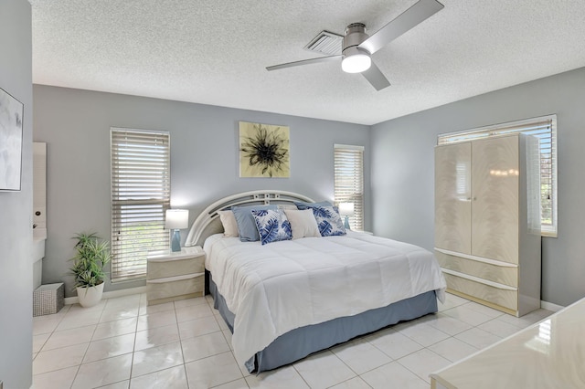 5154 Privet Pl Unit A, Delray Beach, FL 33484 - tiled bedroom with a textured ceiling and ceiling fan