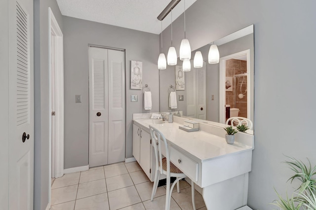 5154 Privet Pl Unit A, Delray Beach, FL 33484 - full bathroom featuring a closet, vanity, tile patterned floors, and tiled shower
