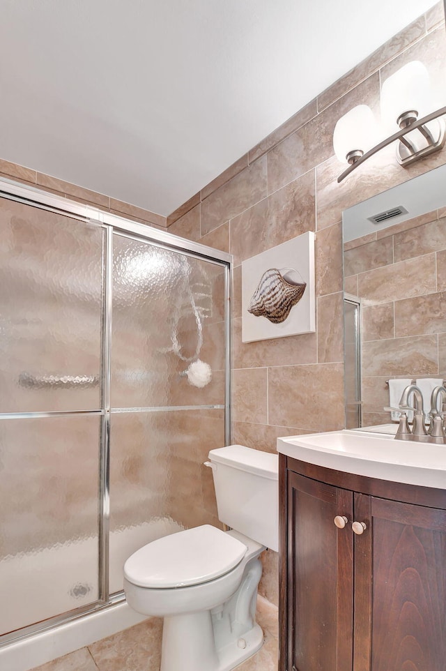 5154 Privet Pl Unit A, Delray Beach, FL 33484 - bathroom featuring tile walls, vanity, and a stall shower