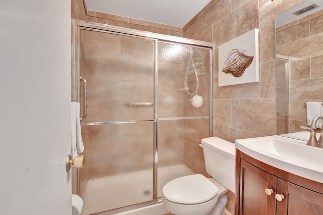 5154 Privet Pl Unit A, Delray Beach, FL 33484 - bathroom featuring tile walls, vanity, and a shower stall