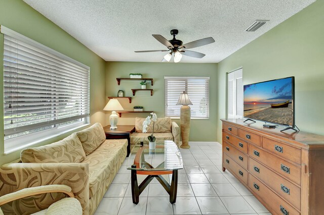 5154 Privet Pl Unit A, Delray Beach, FL 33484 - living room featuring ceiling fan and a textured ceiling