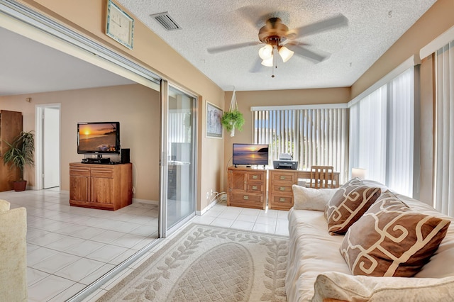 5154 Privet Pl Unit A, Delray Beach, FL 33484 - living room with a ceiling fan, light tile patterned floors, and a textured ceiling
