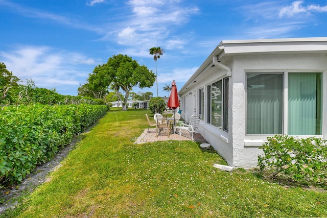 5154 Privet Pl Unit A, Delray Beach, FL 33484 - view of grassy yard featuring a patio area
