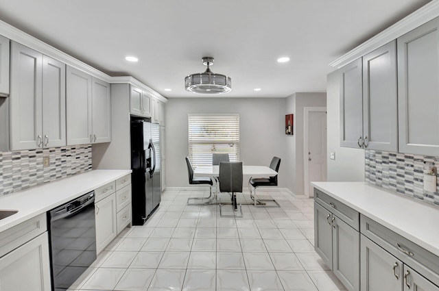 5154 Privet Pl Unit A, Delray Beach, FL 33484 - kitchen with black appliances, light countertops, decorative backsplash, recessed lighting, and gray cabinets