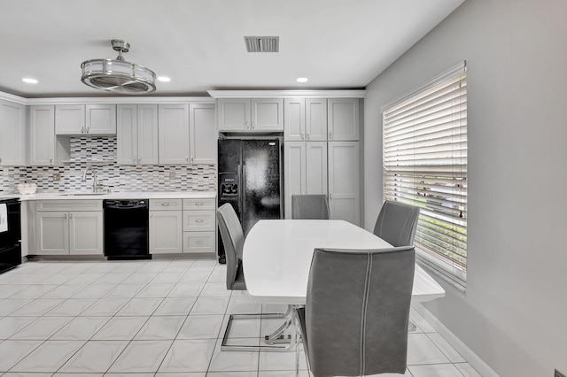 5154 Privet Pl Unit A, Delray Beach, FL 33484 - kitchen featuring black appliances, backsplash, light countertops, recessed lighting, and gray cabinets