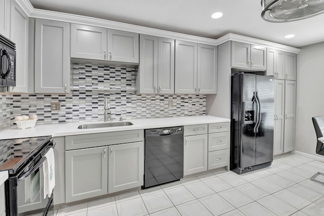 5154 Privet Pl Unit A, Delray Beach, FL 33484 - kitchen with black appliances, gray cabinetry, light countertops, decorative backsplash, and recessed lighting