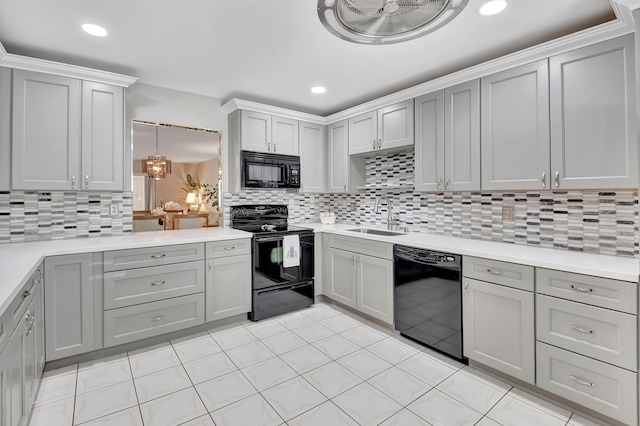 5154 Privet Pl Unit A, Delray Beach, FL 33484 - kitchen featuring black appliances, gray cabinets, decorative backsplash, light countertops, and recessed lighting