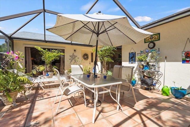 view of patio / terrace with a lanai and outdoor dining space