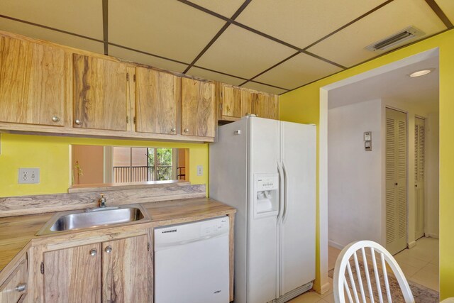 3301 NW 47th Ter Unit 410, Lauderdale Lakes, FL 33319 - kitchen featuring light tile patterned floors, a sink, visible vents, white appliances, and light countertops