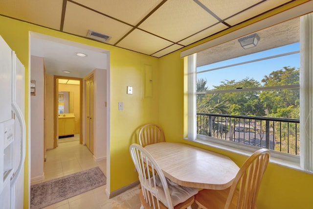 3301 NW 47th Ter Unit 410, Lauderdale Lakes, FL 33319 - dining area with a healthy amount of sunlight, baseboards, light tile patterned floors, and visible vents