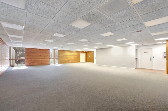 3301 NW 47th Ter Unit 410, Lauderdale Lakes, FL 33319 - carpeted spare room with a paneled ceiling, wood walls, and visible vents