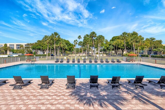 3301 NW 47th Ter Unit 410, Lauderdale Lakes, FL 33319 - community pool with a patio and fence