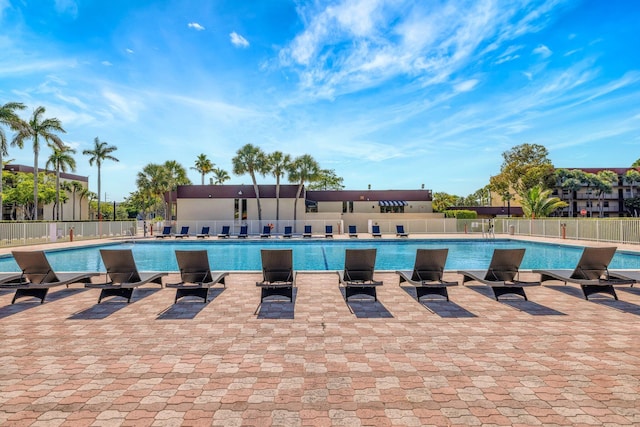 3301 NW 47th Ter Unit 410, Lauderdale Lakes, FL 33319 - community pool featuring a patio and fence