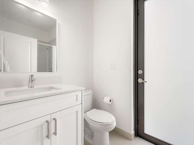 full bathroom with toilet, a shower with door, and vanity