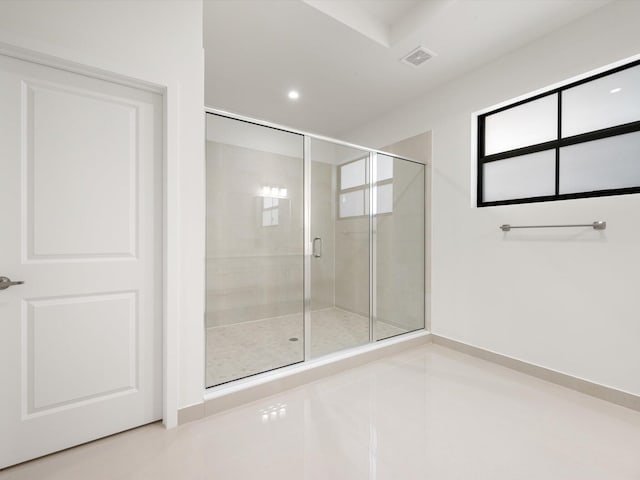 bathroom with a stall shower, recessed lighting, and tile patterned floors