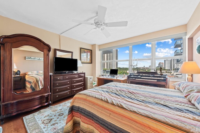 bedroom featuring ceiling fan and wood finished floors