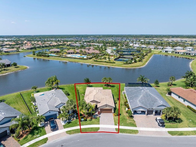 birds eye view of property featuring a residential view and a water view