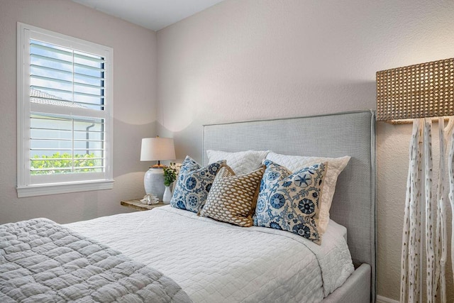 bedroom with multiple windows
