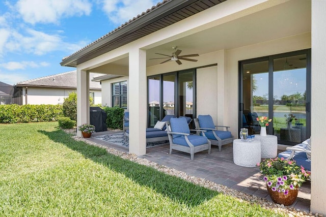 view of patio featuring a ceiling fan