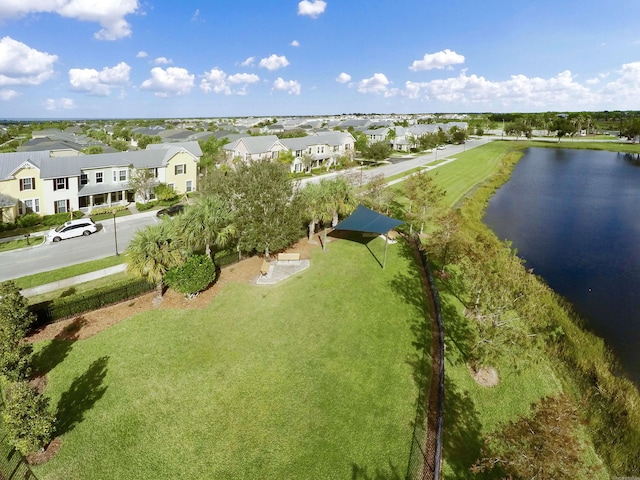 birds eye view of property featuring a water view and a residential view