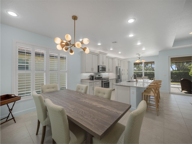 dining room featuring recessed lighting, baseboards, light tile patterned floors, and an inviting chandelier