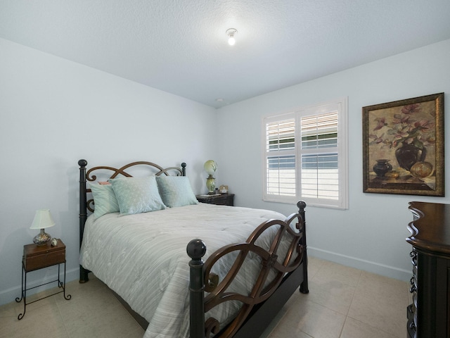 bedroom featuring baseboards