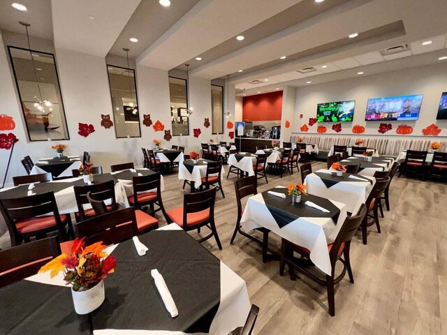 interior space with recessed lighting, light wood finished floors, and visible vents