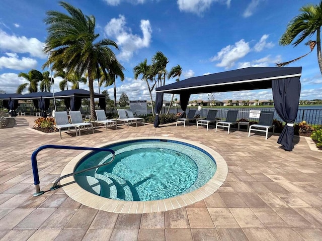 view of swimming pool with a gazebo, a patio area, and fence