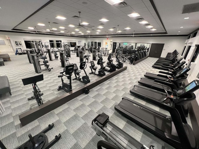 gym featuring carpet flooring, visible vents, and a paneled ceiling