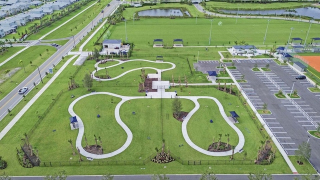 birds eye view of property with a water view