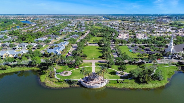 birds eye view of property with a water view and a residential view