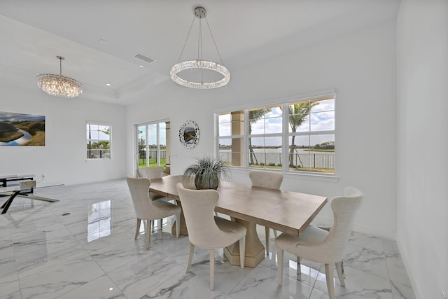 dining room with a chandelier, visible vents, marble finish floor, a tray ceiling, and recessed lighting