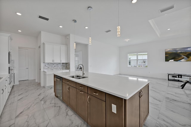 kitchen with a sink, appliances with stainless steel finishes, marble finish floor, and visible vents