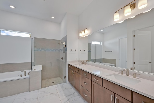 bathroom with a sink, a bath, and a stall shower