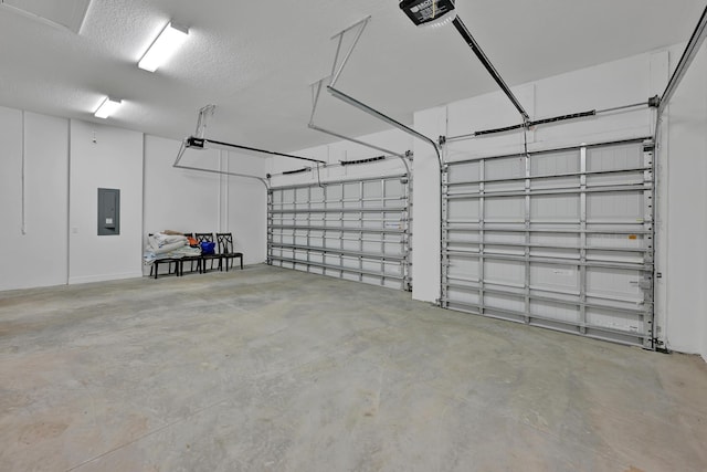 garage featuring a garage door opener and electric panel
