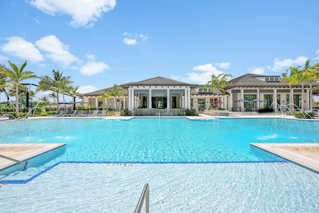 community pool with a patio area
