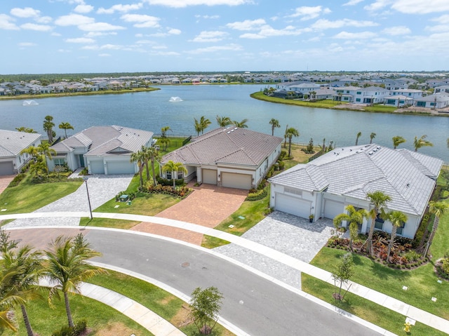 bird's eye view featuring a water view and a residential view
