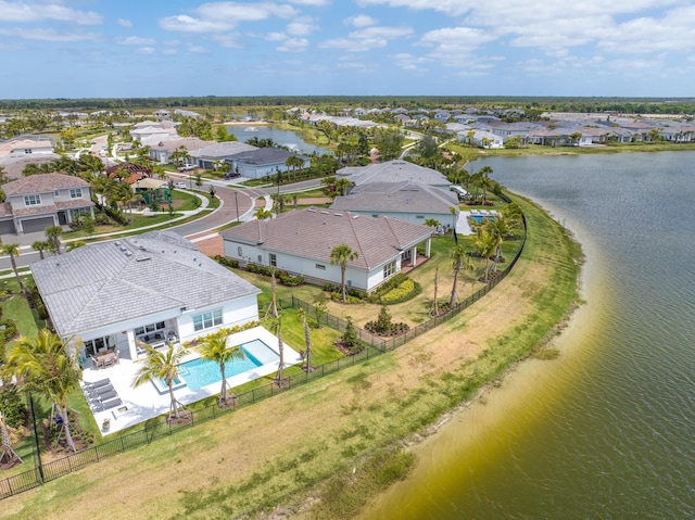 birds eye view of property with a water view and a residential view