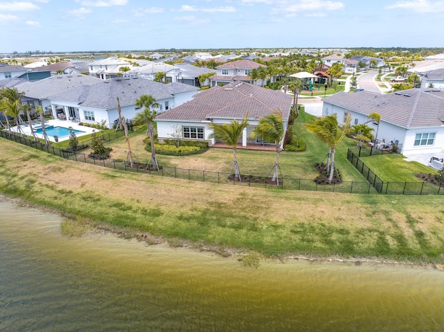 aerial view featuring a water view and a residential view