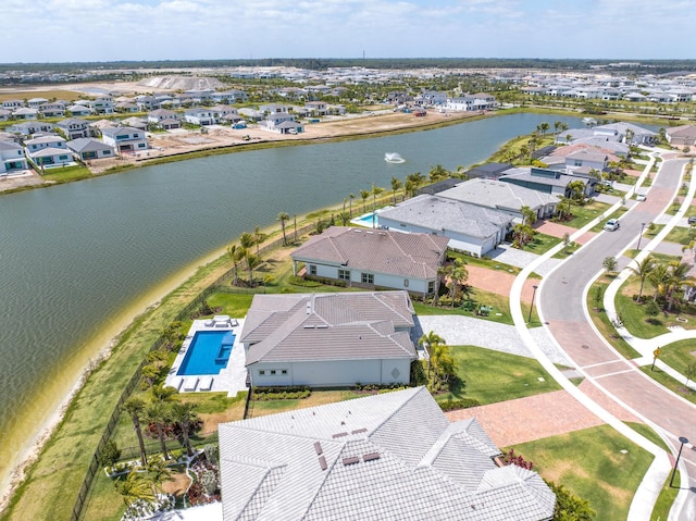 bird's eye view featuring a residential view and a water view