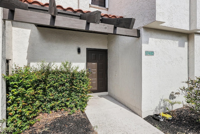 5748 Fox Hollow Dr Unit D, Boca Raton, FL 33486 - view of exterior entry featuring stucco siding