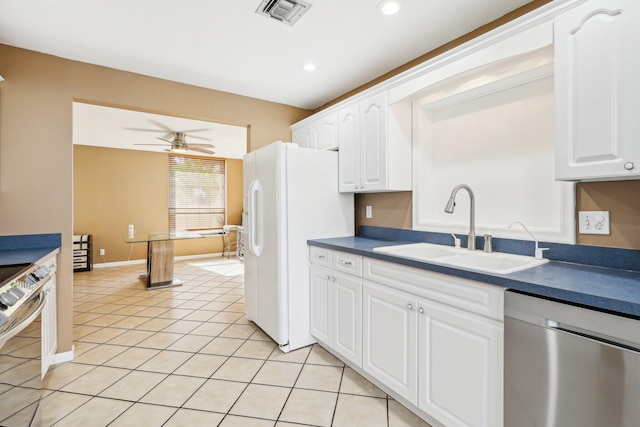 5748 Fox Hollow Dr Unit D, Boca Raton, FL 33486 - kitchen with dark countertops, ceiling fan, a sink, stainless steel appliances, and visible vents