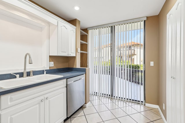 5748 Fox Hollow Dr Unit D, Boca Raton, FL 33486 - kitchen with dark countertops, dishwasher, white cabinetry, a sink, and light tile patterned floors