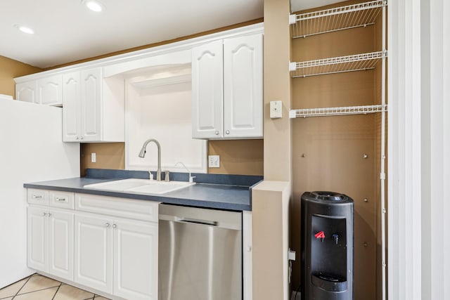 5748 Fox Hollow Dr Unit D, Boca Raton, FL 33486 - kitchen featuring a sink, dark countertops, stainless steel dishwasher, and white cabinetry