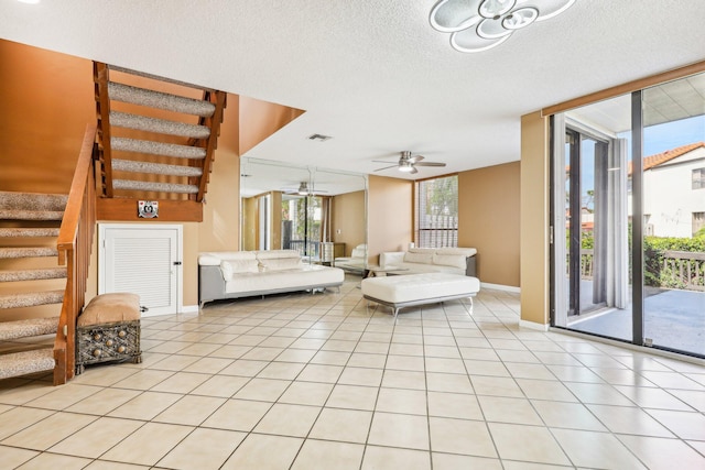 5748 Fox Hollow Dr Unit D, Boca Raton, FL 33486 - living area featuring ceiling fan, visible vents, light tile patterned floors, and stairway