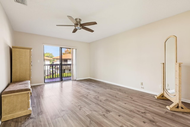 5748 Fox Hollow Dr Unit D, Boca Raton, FL 33486 - unfurnished room featuring baseboards, a ceiling fan, wood finished floors, and visible vents
