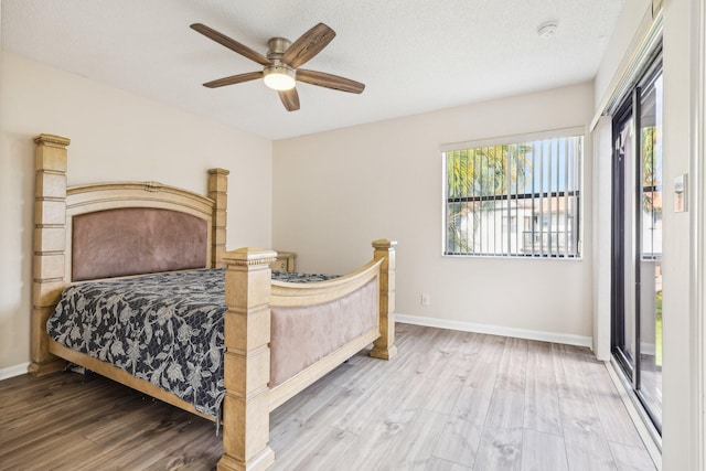 5748 Fox Hollow Dr Unit D, Boca Raton, FL 33486 - bedroom with access to outside, baseboards, a ceiling fan, and wood finished floors