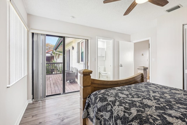 5748 Fox Hollow Dr Unit D, Boca Raton, FL 33486 - bedroom featuring visible vents, access to exterior, light wood-style floors, baseboards, and a textured ceiling