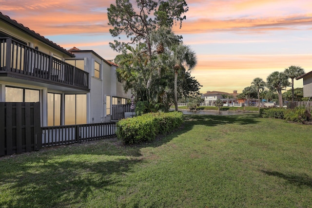 5748 Fox Hollow Dr Unit D, Boca Raton, FL 33486 - yard at dusk with fence and a balcony